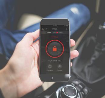 A Man Accessing His Smart Home Security System With Mobile Control4 App